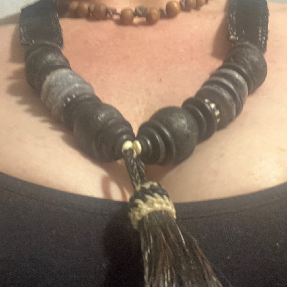 beaded necklace suede leather stitching and tassel braided on with hemp rope